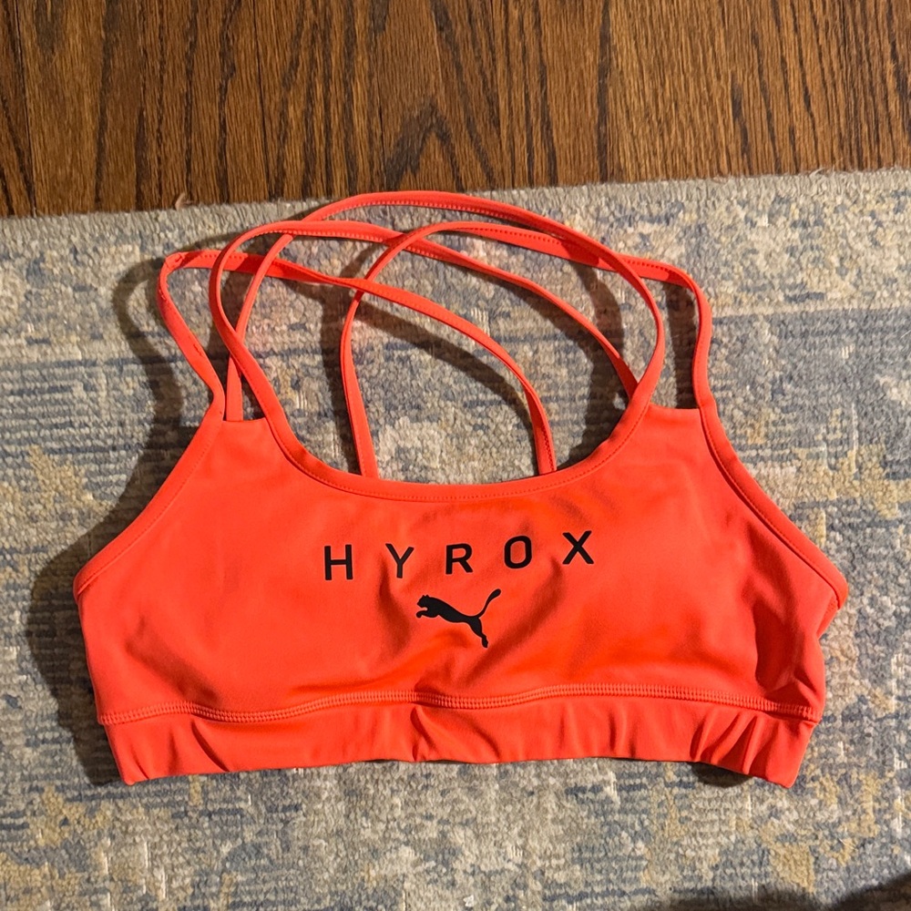 Puma hyrox Strappy Sports Bra in Bright Orange